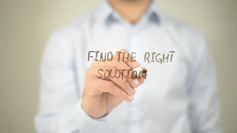 Find The Right Solution , man writing on transparent screen Stock Photos