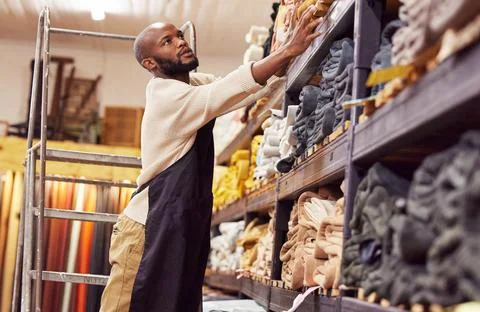 Find the solution for a problem in your own life. Shot of a young man working Stockfoto's