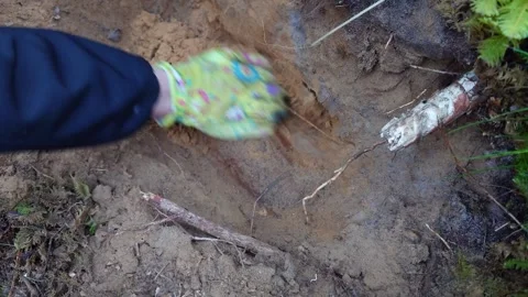 Finding and Unearthing an Unexploded WW2 Shell in a Forest Vlog Stock Footage 292284816