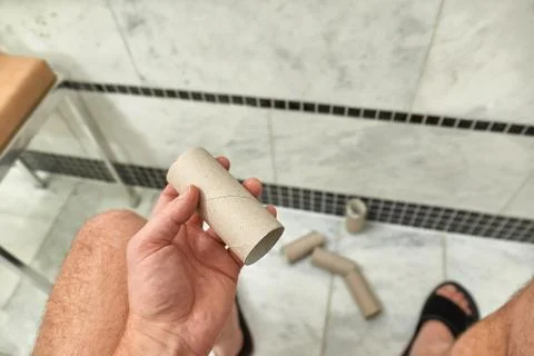 Finding empty roll in the restroom Stock Photos