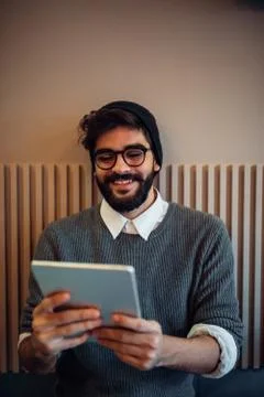 Finding the facts he needs online Stock Photos