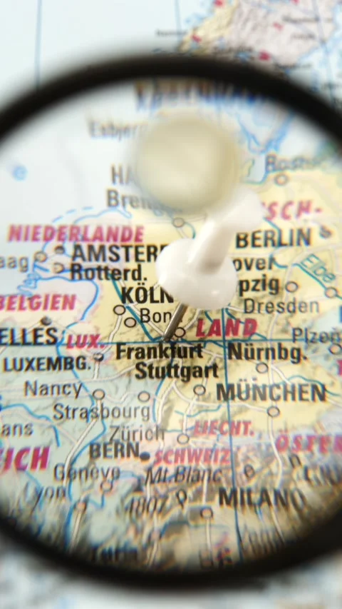 Finding Frankfurt on a printed paper map Stock Footage 343288211