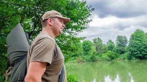 Finding a lake and kneeling down to observe water Video stock 112174878