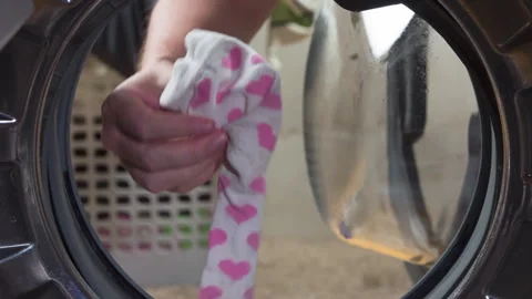 Finding a Lost Sock in the Washing Machine 4K Stock Footage 336636345