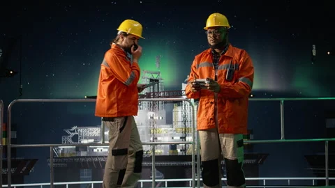 Finding new petrol extraction sites, drone close up and drilling rig crew Stock Footage 336197187