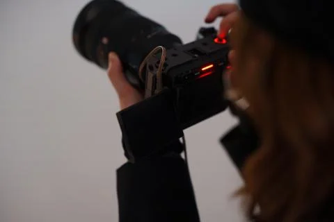Finding the perfect shot while holding a camera Stock Photos