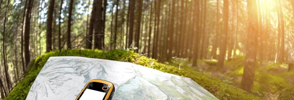 Finding the right position in the forest via gps Stock Photos