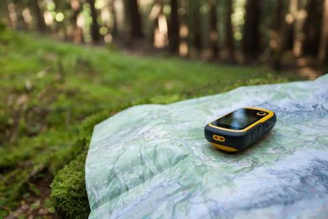Finding the right position in the forest with a gps Stock Photos
