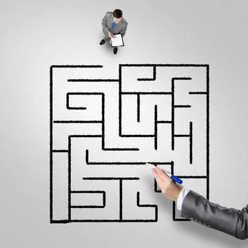 Finding right problem solution Top view of puzzled businessman looking at ... Stock Photos