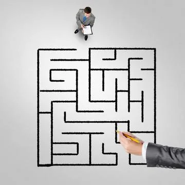 Finding right problem solution Top view of puzzled businessman looking at ... Stock Photos