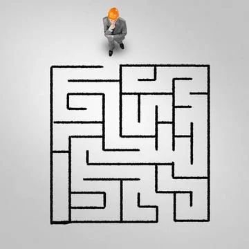 Finding right problem solution Top view of puzzled businessman in helmet l... Stock Photos