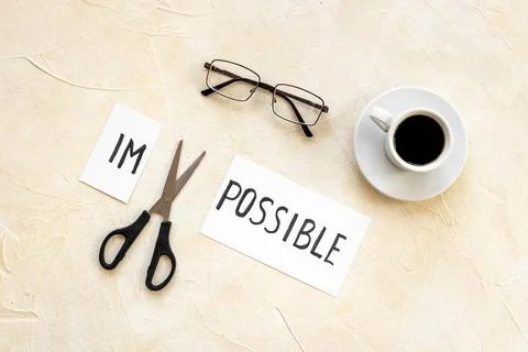 Finding solution concept. Changing word impossible to possible with scissors Stock Photos