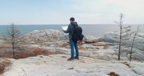Finding the way on the map in the mountains. Stock Footage 248065480