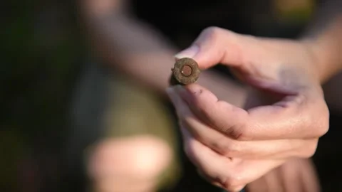 Finding a WW2 Bullet in Dirt in Forest with a Metal Detector Stock Footage 292284785