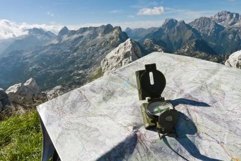 Finding your way with a compass and a map Stock Photos