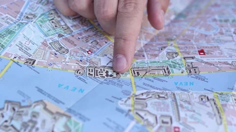 Finding your way with a paper map Stock Footage 273070643