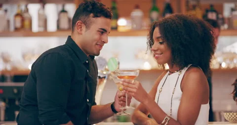 The fine art of flirtation. 4k video footage of a young man and woman toasting Stock Footage