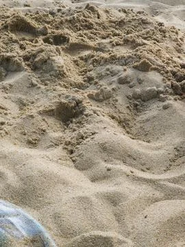 Fine beach sand texture in close-up, ideal as a conceptual natural background Stock Photos