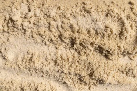 Fine beach sand with textured surface and natural patterns Stock Photos