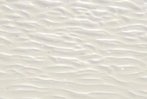 Fine beach white sand texture in summer sun. Background for your design Stock Photos