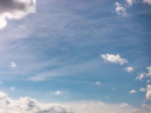 Fine Cloud Wisps Above a Low Band of Distant Clouds Stock Photos