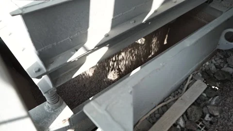 Fine crushed stone in the gutter of the shale shaker. Slow motion Stock Footage 200869355