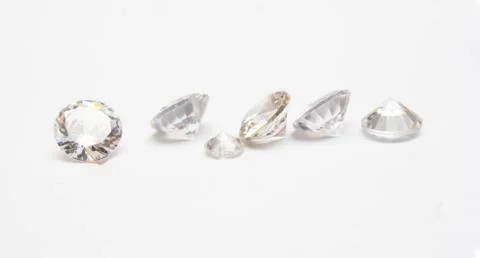 Fine diamond on a white background Stock Photos