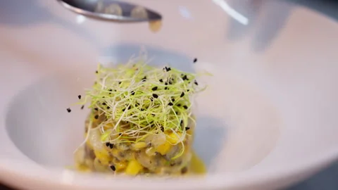 Fine dining: courses being carefully prepared in the kitchen by the chef. Stock Footage 325190262