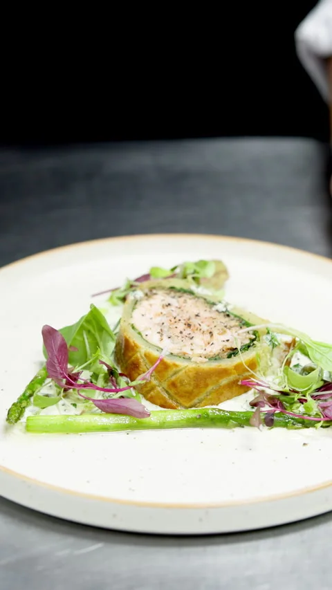 Fine dining, hands and salmon wellington in commercial kitchen for gourmet Stock Footage 327361565