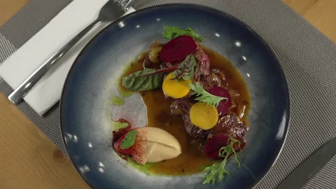 Fine dining meal with meat on the restaurant table Video stock 236994849
