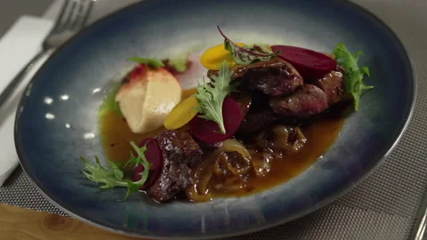 Fine dining meal with meat on the restaurant table Video stock 236994863