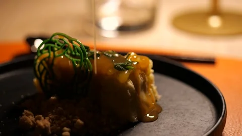 Fine dining modern dessert presentation in a restaurant setting. Stock Footage 328988273