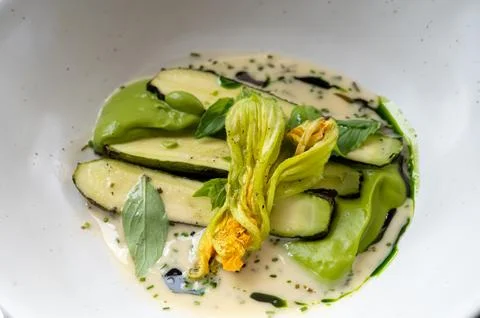 Fine dining in restaurant with chef, main vegetarian dish with young zucchi.. 写真素材