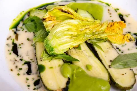 Fine dining in restaurant with chef, main vegetarian dish with young zucchi.. Stock Photos
