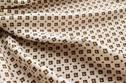 Fine fabric with a geometric pattern Stock Photos