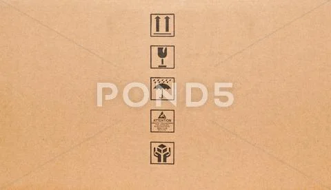 Fine image close-up of black fragile symbol on cardboard Stock Photos