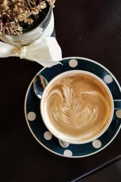 Fine latte heart shape flat lay view hot fresh coffee in cafe. Stock Photos