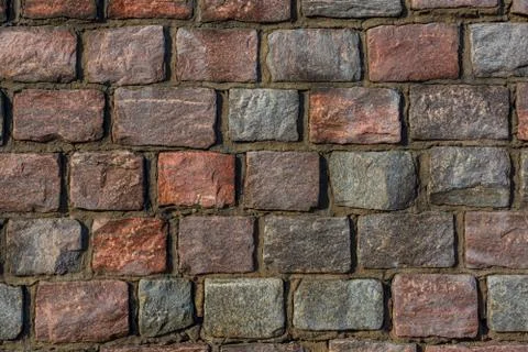 Fine masonry of short rectangular granite blocks, wall background Stock-Fotos