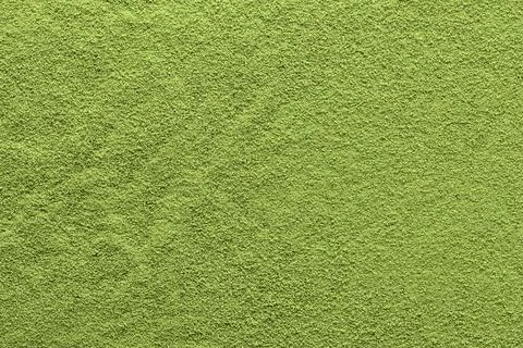 Fine matcha powder forms an even green surface with subtle texture, ideal as  Foto stock