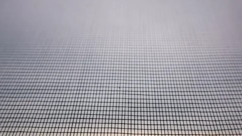Fine Mosquito Net Mesh Protective Screen on Window at Evening Sunset Stock Footage 334735771