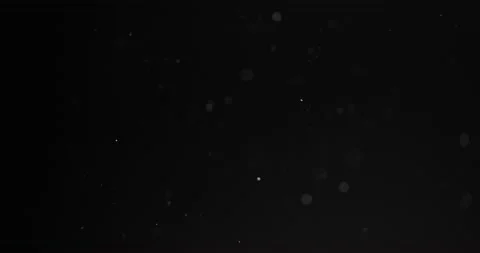 Fine particles flying around against dark background Video stock 155402819