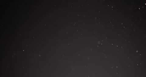 Fine particles flying around against dark background Video stock 155535361