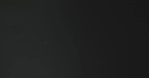 Fine particles flying around against dark background Video stock 164204715