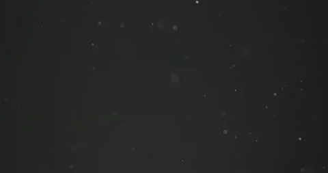 Fine particles flying around against dark background Video stock 166245384
