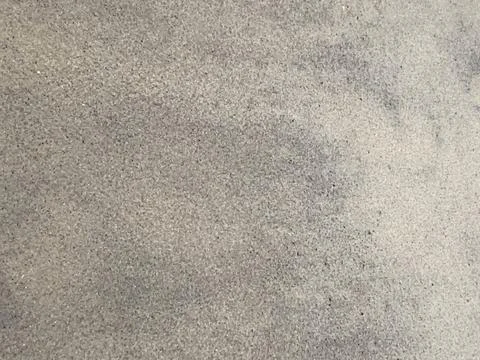 Fine Sandy Beach Surface With Subtle Patterns and Textures Under Soft Natur.. Stock Photos