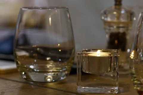 Fine table setting in gourmet restaurant. Salt, pepper shaker and candle Foto stock