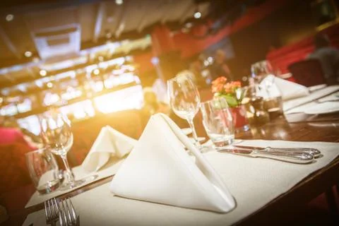 Fine table setting with yellow light flare Stock Photos