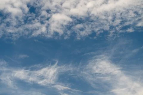 Fine textural cloud arrangements creating contrasting patterns in sky. Subt.. Stock Photos