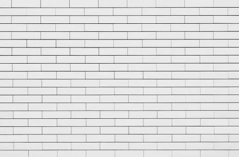 Fine texture of wall bricks. Background. Black and white image. Stock Photos