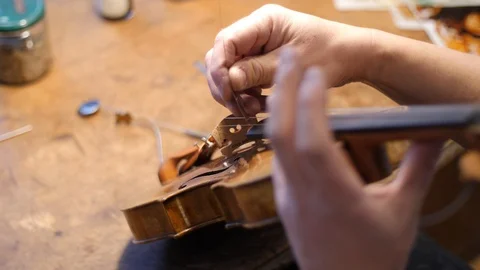 Fine tune a Violin / Making a Violin Stock Footage 108116582